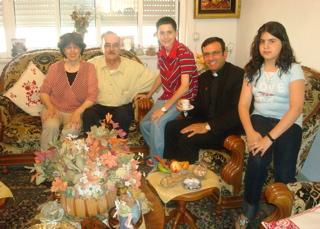 Father Samer visiting with family (sy)