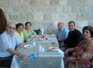 Father Samer has watermelon with friends in Ramalla? (sy)