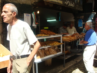 Bill getting bread at bakery in Old Jerusalem (hs)