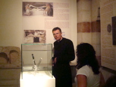 Father Kelly giving a tour of the Notre Dame museum of the Shroud (hs)