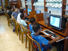 Kids playing games in Internet Cafe in Old Jerusalem (rw)