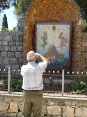Subi takes picture of the Icon of the Transfiguration outside the Monastery (rw)