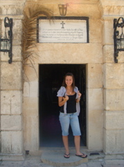 Natalia at the entrance to the Monastery of Transfiguration on Mount Tabor (hs)