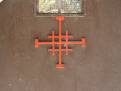 Jerusalem Cross on gate near the First Miracle Church in Cana of Galilee (rw)