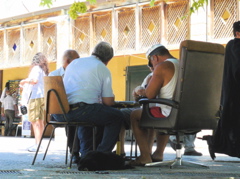 Playing cards in the shade on the square, Nazareth (rw)