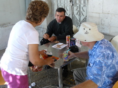 Father Samer eating nuts with Suad and Fuad, Nazareth (rw)