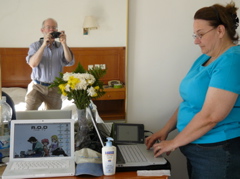 Still life with flowers, laptops, Sony PRS, Robert and Ann, in Nazareth hotel room (rw)