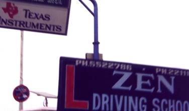 Signs on road - Texas Instruments and Zen Driving School