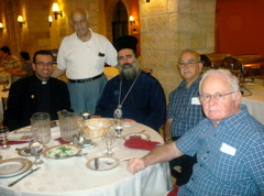 Father Samer, Naim, Subi, and Fuad with the Bishop, in the dining hall at Notre Dame Jerusalem Center (sy)