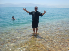Father Samer in the Sea of Galilee (sy)