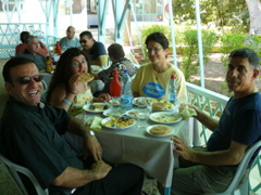 Father Samer, Hope, Minerva, and Salim at Al Rawdah Restaurant in Jericho (rw)