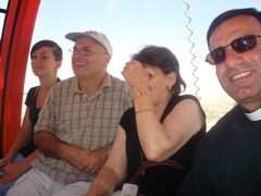 Nicole, George, Widad, and Father Samer in the cable car to Mount Temptation (sy)