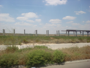 Roman Aquaduct?  No, new elevated light rail line under construction in the countryside (sy)