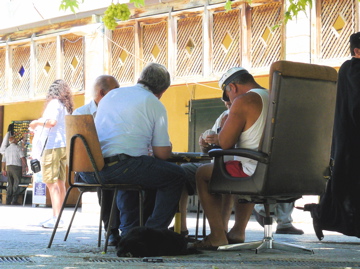 Playing cards in the shade on the square, Nazareth (rw)