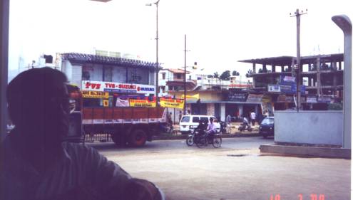 Street scene with Goutam Das at gas station